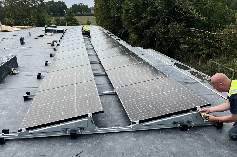 Finishing The Final Panel On NHS Flat Roof Commercial Installation